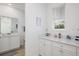 Half bathroom with white cabinets, a window, and nautical-themed decor at 2956 Caribbean Soul Dr, Kissimmee, FL 34747