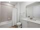 Clean and bright bathroom with white cabinetry and tiled shower at 2956 Caribbean Soul Dr, Kissimmee, FL 34747