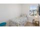 Cozy bedroom with a twin bed, window, and a small side table at 2956 Caribbean Soul Dr, Kissimmee, FL 34747