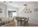 Dining area with table and chairs next to sliding glass doors at 2956 Caribbean Soul Dr, Kissimmee, FL 34747