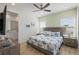 Inviting main bedroom with a king-size bed, ceiling fan, and an ensuite bathroom at 2956 Caribbean Soul Dr, Kissimmee, FL 34747