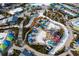 Overhead view of a water park with slides and colorful cabanas at 2956 Caribbean Soul Dr, Kissimmee, FL 34747