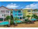 Aerial view of colorful townhouses with private pools at 3056 Parrot Head Pl, Kissimmee, FL 34747