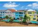 Aerial view of colorful townhouses with private pools at 3056 Parrot Head Pl, Kissimmee, FL 34747