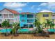 Aerial view of a colorful two-story house with a private pool at 3056 Parrot Head Pl, Kissimmee, FL 34747