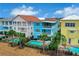 Aerial view of colorful townhouses with private pools at 3056 Parrot Head Pl, Kissimmee, FL 34747