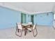 Covered balcony with outdoor seating and water views at 3056 Parrot Head Pl, Kissimmee, FL 34747