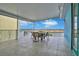 Covered balcony with outdoor seating and water views at 3056 Parrot Head Pl, Kissimmee, FL 34747