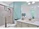 Bathroom with single vanity and walk-in shower at 3056 Parrot Head Pl, Kissimmee, FL 34747