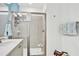 Clean bathroom with a walk-in shower and neutral tile at 3056 Parrot Head Pl, Kissimmee, FL 34747