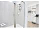 Bathroom with shower, walk-in closet, and modern vanity at 3056 Parrot Head Pl, Kissimmee, FL 34747