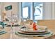 Table set for a meal with decorative parrot napkin holders at 3056 Parrot Head Pl, Kissimmee, FL 34747