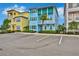 Two-story light blue house with teal accents and palm trees at 3056 Parrot Head Pl, Kissimmee, FL 34747