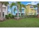 Two-story light blue house with private pool and lush lawn at 3056 Parrot Head Pl, Kissimmee, FL 34747
