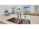 Kitchen features a sink with a view of the backyard at 3056 Parrot Head Pl, Kissimmee, FL 34747