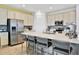 Modern kitchen with stainless steel appliances and white cabinets at 3056 Parrot Head Pl, Kissimmee, FL 34747