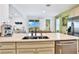 Kitchen features a sink with a view of the backyard at 3056 Parrot Head Pl, Kissimmee, FL 34747