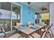 Covered patio with dining table, chairs, and view of the pool at 3056 Parrot Head Pl, Kissimmee, FL 34747