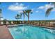 Inviting pool and spa area with a view of the lake at 3056 Parrot Head Pl, Kissimmee, FL 34747