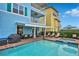 Private pool and spa with lounge chairs and outdoor dining area at 3056 Parrot Head Pl, Kissimmee, FL 34747