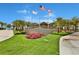 Margaritaville Resort entrance with landscaping and flags at 3056 Parrot Head Pl, Kissimmee, FL 34747