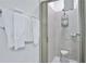Walk-in shower with glass enclosure and built-in shower caddy at 3056 Parrot Head Pl, Kissimmee, FL 34747