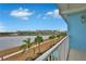 Stunning view of lake, resort, and lush landscaping at 3056 Parrot Head Pl, Kissimmee, FL 34747