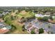 Aerial view showing community, lake, and golf course at 3965 Journey Ct, Casselberry, FL 32707