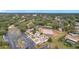 Aerial view of community, tennis court, pool, and surrounding area at 3965 Journey Ct, Casselberry, FL 32707