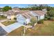 Gray house with a two-car garage and landscaping at 3965 Journey Ct, Casselberry, FL 32707