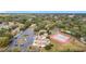 Aerial showing community features: tennis court, pool, homes, and parking at 3965 Journey Ct, Casselberry, FL 32707
