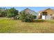 Spacious backyard with lush grass and mature trees at 3965 Journey Ct, Casselberry, FL 32707
