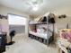 bedroom with a bunk bed and ample storage at 3965 Journey Ct, Casselberry, FL 32707