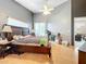 Main bedroom with wood floors and access to bathroom at 3965 Journey Ct, Casselberry, FL 32707