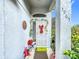Front entry with holiday decor and a decorative door at 3965 Journey Ct, Casselberry, FL 32707