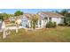 Gray house with a two-car garage and landscaping at 3965 Journey Ct, Casselberry, FL 32707