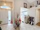 Bright foyer with view into kitchen and living areas at 3965 Journey Ct, Casselberry, FL 32707