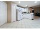 Kitchen with white cabinets and view to living room at 3965 Journey Ct, Casselberry, FL 32707