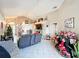 Open and inviting living room with a view of the kitchen at 3965 Journey Ct, Casselberry, FL 32707