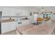 Bright kitchen with white cabinets, ample counter space, and a breakfast nook at 4783 Cumbrian Lakes Dr, Kissimmee, FL 34746