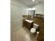 Clean, updated bathroom featuring a new vanity, toilet, and tiled flooring at 8711 Rockingham Ter # D, Kissimmee, FL 34747