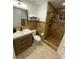 Full bathroom with tiled shower, vanity, and toilet at 8711 Rockingham Ter # D, Kissimmee, FL 34747