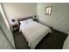 Inviting bedroom with comfortable bed, nightstands, and a wood-look floor at 8711 Rockingham Ter # D, Kissimmee, FL 34747