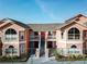 Attractive two-story condo building with balconies and stairs at 8711 Rockingham Ter # D, Kissimmee, FL 34747
