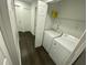 Convenient in-unit laundry room with a stacked washer and dryer at 8711 Rockingham Ter # D, Kissimmee, FL 34747