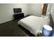 Main bedroom with a king-size bed, nightstands, dresser, TV, and ensuite bathroom access at 8711 Rockingham Ter # D, Kissimmee, FL 34747