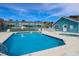 Community pool, tennis court, and clubhouse at 8711 Rockingham Ter # D, Kissimmee, FL 34747