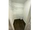 Spacious walk-in closet with wire shelving and dark wood-look flooring at 8711 Rockingham Ter # D, Kissimmee, FL 34747