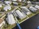 Aerial view highlighting a waterfront home in a community setting at 115 Palm Dr, Eustis, FL 32726