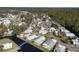 Wide aerial view of a large waterfront community and its landscape at 115 Palm Dr, Eustis, FL 32726